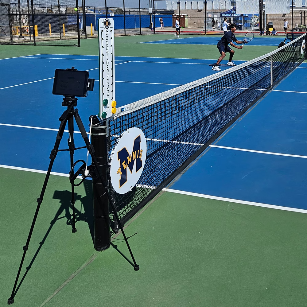 SwingVision review equipment at a high school tennis event.