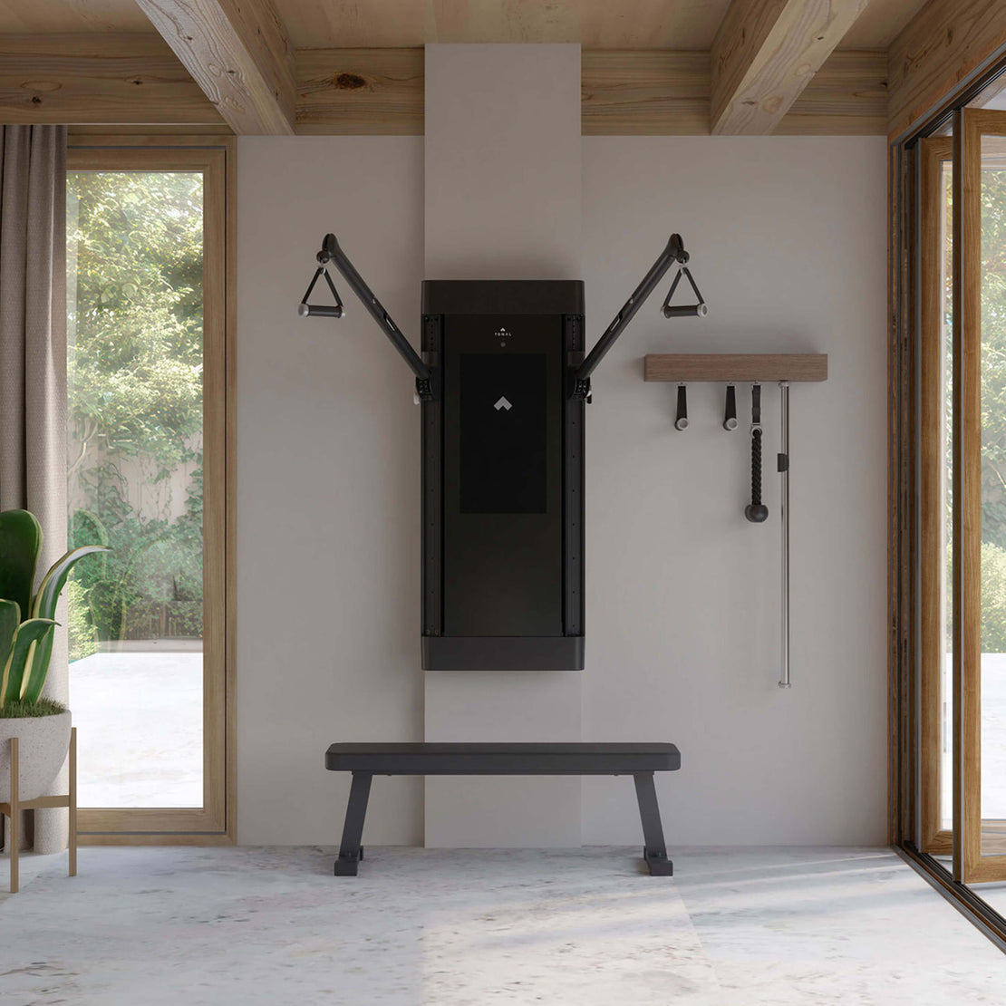 A Tonal wall-mounted trainer in a home workout space.